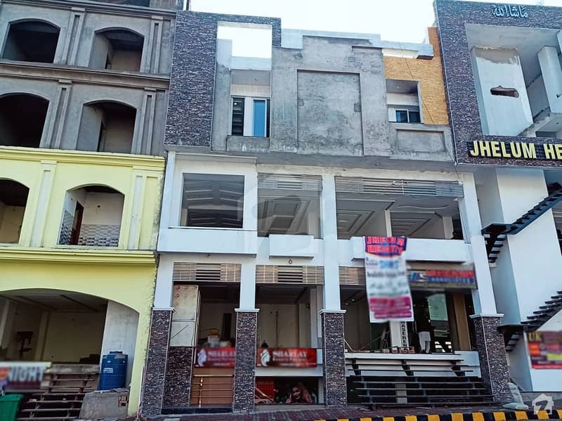 سٹی ہاؤسنگ سکیم جہلم میں 1 مرلہ دکان 68 لاکھ میں برائے فروخت۔