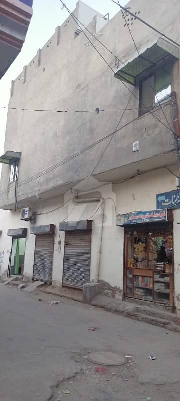 2.5 Marla Corner House With 4 Shops For Sale In Bawa Chak Sargodha Road