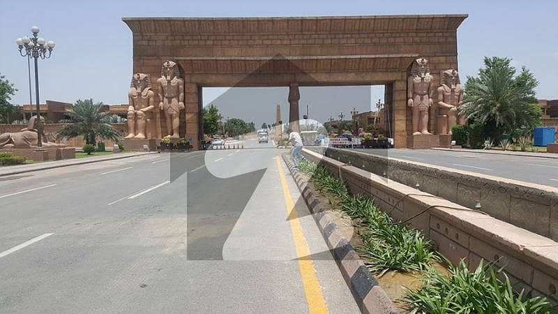 IMC ESTATE OFFERING 10 MARLA PRIME AND HOT LOCATION POSSESSION UTILITY PAID CORNER 25 SQ FT PAID ALL DUES CLEAR PLOT FOR SALE IN OVERSEAS A BLOCK BAHRIA TOWN LAHORE