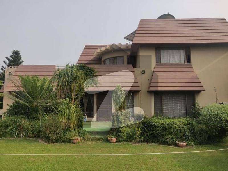 2 KANAL FULLY BASMENT MODERN BUNGALOW WITH ONE KANAL LAWN AND ONE KANAL BUNGALOW FOR SALE IN PHASE 2 by syed brothers