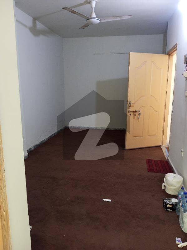 Semi Furnished Carpeted Room With Attached Washroom And Kitchen