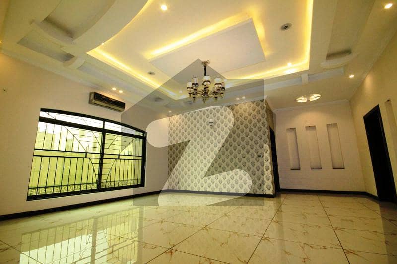 1 Kanal Full Basement Spanish Corner Bungalow With Home Theater For