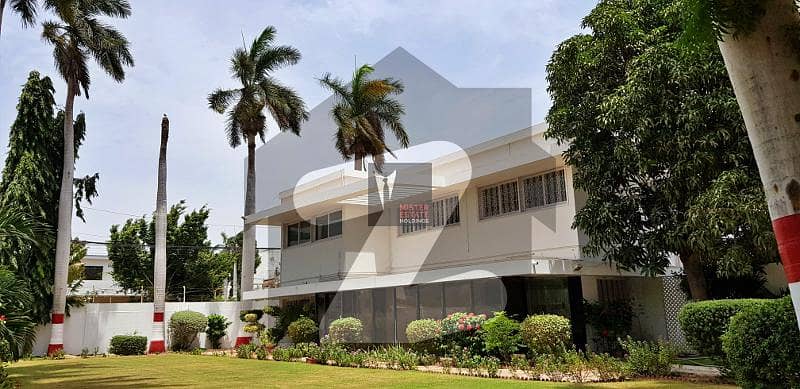 1000 Yards Commercial Use Bungalow With Three Entrance Gates, Huge Parking Lot And A Beautiful Garden On Main Tipu Sultan Road Off Karsaz For Reputable Entities Willing To Establish Their Corporate Office In Karachi's Most Sought After Locality