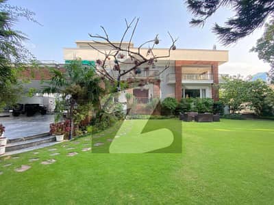 F. 7 Luxury house 4 kanal outclass location 8 Besroom Drawing Dining Lounge theater elevator swimming pool Gym Lush Green Lawn on Front and Back side F. 7 Luxury house 4 kanal outclass location 8 Besroom Drawing Dining Lounge theater elevator swimming pool Gym Lush Green Lawn on Front and Back side