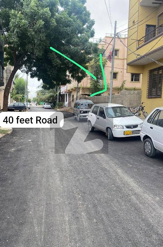 PRIME LOACTION CORNER 100 YARDS PLOT WITH EXTRA LAND . BOUNDARY WALL