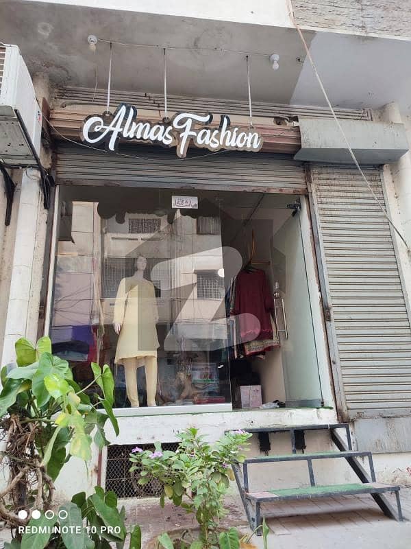 DEFENCE PHASE V :- SHOP FOR SALE RUNNING RENT INCOMING 40 THOUSANDS BADAR COMMERCIAL AREA 310 SQFT SHOP WITH BASEMENT