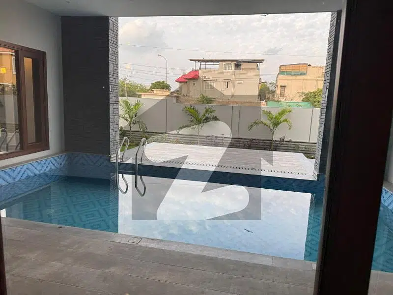 1000 Yards Brand New Corner House With Complete Basement And Swimming Pool