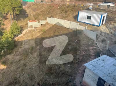 21 Marla Commercial Plot for sale on Main Expressway Near Geloria Jeans Coffee Murree