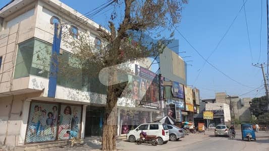 A Good Location Corner Shop In Plaza With Basement And Vast Parking Area