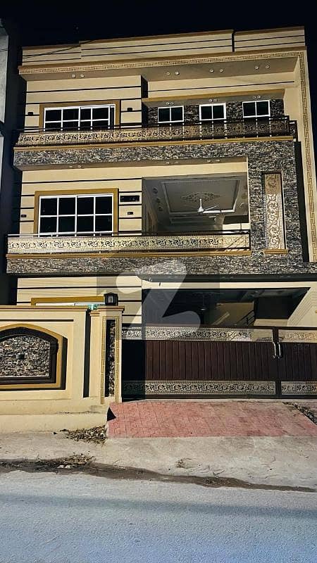10 Marla Brand New Triple Story House Available For Sale In Gulshan Abad.