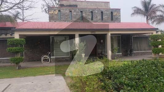 9 Kanal Farm House For Sale Along With Lush Green Area And Other Facilities You Get Swimming Pool And Space For Barbeque And Ideal Location