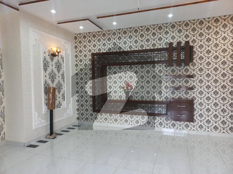 10 marla new tile floor 5bed double story house in Tariq Garden near wapda town