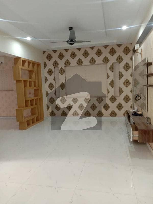 10 marla new 5bed tile floor triple story house in Tariq Garden near wapda town