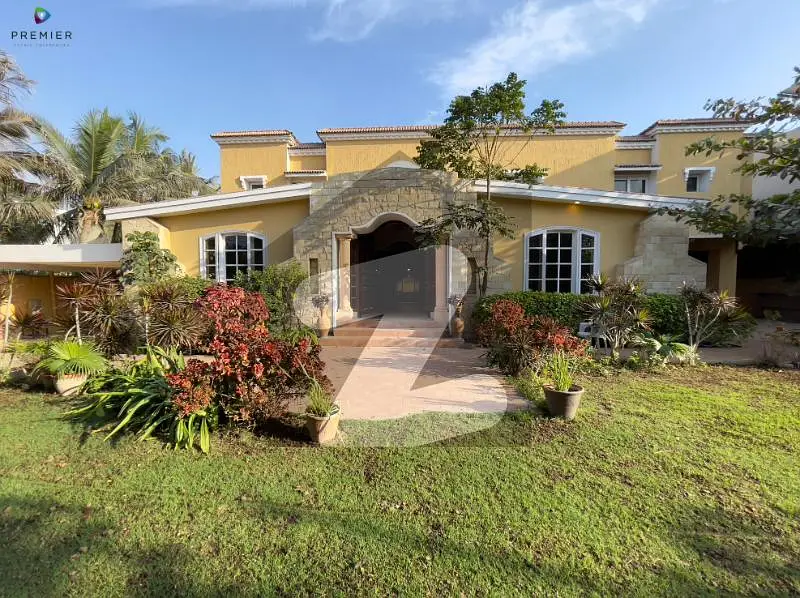 Exclusive Listing - The Spanish Casa - 1000 Yards - Central Location Of Phase-VI - 1+3 Bedrooms - Guest Room - 90 X 100 - Outdoor Pool - Without Basement - Lush Green Maintained Garden !