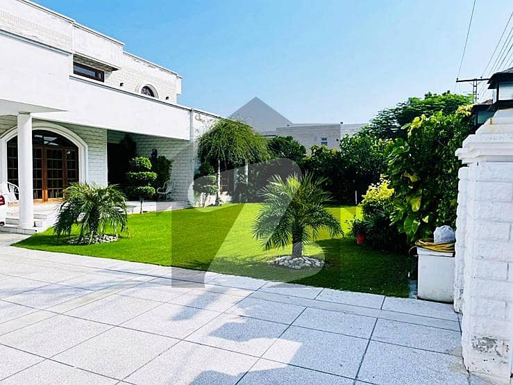 2 kanal slightly used lavish bungalow for sale with beautiful lush green lawn