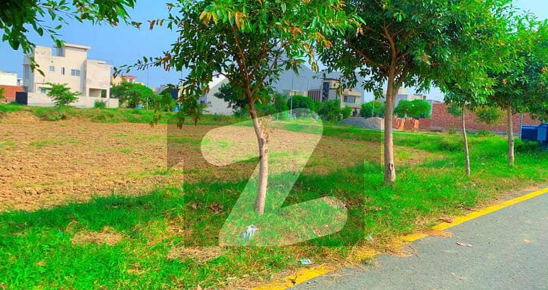 20 Marla Plot No Near In Block ( 76 ON 100 WIDE ROAD Q) Surrounding Houses Reasonable Price For Sale DHA Lahore