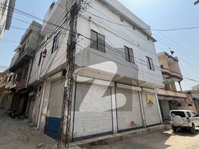 Building with 2 Shops and 2 Apartments for Sale on Adiala road : A real-life example of a building with shops and apartments