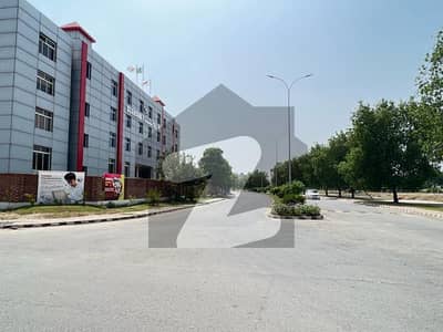 Hot Location 16 Marla Commercial Plot For Sale Facing Rosans Islamic School In Lake City Lahore.