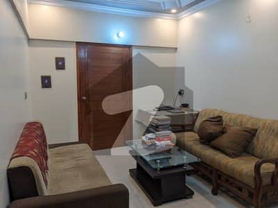 Well maintain 1st floor 3 bed drawing dinning tyled flooring flat available for sell in Al firdous appartment block 2 main road imtiaz