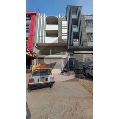 Commercial Building 100 Sq Yd Ground +Basment + Meznine. Main 150fit Road