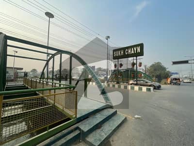 10 Marla Plot For Sale In Sukh Chayn Gardens Near Bahri Town Lahore