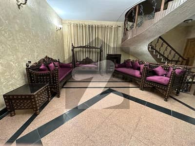 F-11 TRIPLE STOREY HOUSE TILED FLOOR 8 BEDS 2 KITCHENS TERRACE AND BEAUTIFUL LAWN