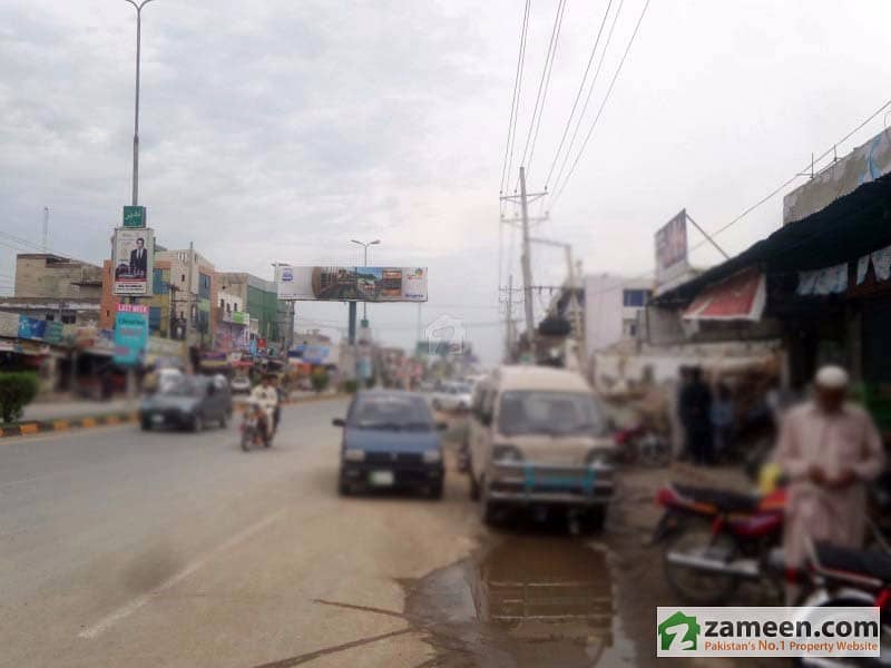 House With 7 Shops Available For Sale University Road, Sargodha