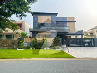 1 Kanal Elegant And Fully Maintained Super Hot Located Bungalow With Full Basement And Pool Is Available For Sale In The Best Block Of DHA Lahore.