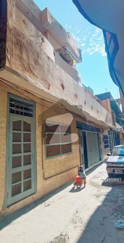 Outer wall of Faizia Housing Society A Beautiful And Excellent Constructed 3 Stories House 6 Marla Covered Area 3055 Square feet For Sale With 42.5 Feet Front. Bed Rooms No 7 Wash Rooms No 5 Drawing Dinning