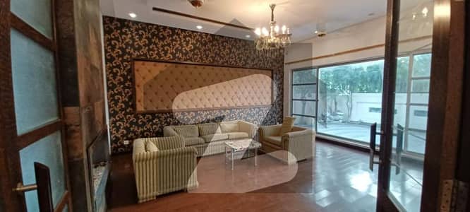 Facing Park & Mosque Spacious 1-Kanal Slightly Used Full House With 5 Bedrooms, Stylish Design & Prime Location In DHA Phase 5 Best Price With Wall Green Realtors