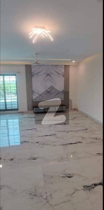 Experience Grand Living in a Brand New 10 Marla Park-Facing Luxury Apartment for Rent 3 Beds with Attached Baths, Rooftop Garden, Sauna, Gym, and 24/7 Security by Wall Green Realtors