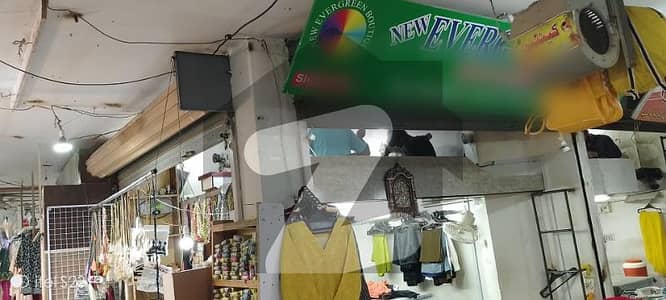 Shop For Sale In Harmain Tower VIP Location Near Jauhar More Chalti Hovi Market Main Rode Project Car Parking
