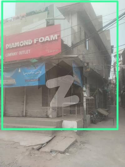 Very Busy Road and street with huge public access to Saddar Bazar.    Corner Shop + House for Sale Prime Location on Busy Road!  Location: Saddar Lahore Main Road near Gol Chakar, Lahore Road Lahore