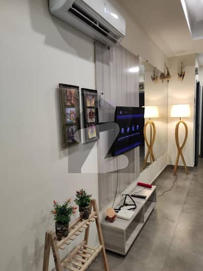 Bahria town phase 7 Rawalpindi two bedrooms apartment brand new luxury fully furnished 3rd floor lift 24/7 WiFi security camera system family plaza near Stylo shoes Long time monthly for rent available