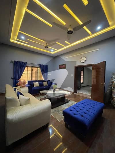Furnished 10 Marla designer house in Jhang premium finishing, modern kitchen & car porch.