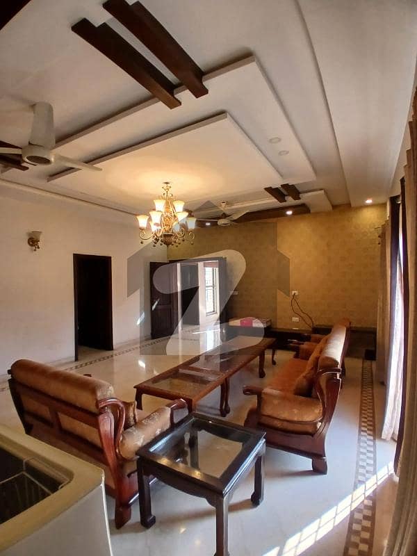 Glamorous Family Paradise Elegant DHA Masterpiece 1-Kanal Brand New Luxury House Constructed with High-Quality Material, Offering 5 Stylish Bedrooms, Modern Company Kitchen, Spacious TV Lounges, Servant Quarter, DHA Phase 6 K Block