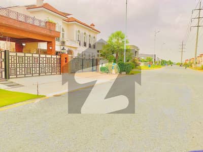 350-R - 1 Kanal Plot on Main Road Near DHA Raya Directly Approach MB Road in Phase 7 Block R Surrounding Houses right side Plot lown