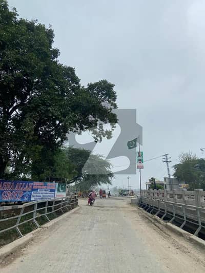 200 kanal top location farm house land for sale on barki road opposite of dha phase 7 canal front