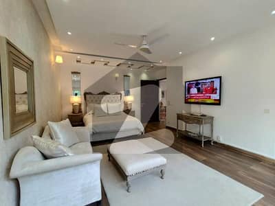A Masterpiece of Sophisticated Living Fully Furnished 1-Kanal Lower Portion Available for Rent at Prime Location of DHA Phase 6 | Upper Locked for Complete Privacy | Ideal Home with Lush Lawn & Stylish Kitchen Setup!