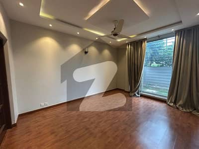 A Smart Rental Deal Beautifully Constructed 10-Marla DHA House with Spacious TV Lounges, Drawing & Dining, Servant Quarter, and Green Surroundings at Low Rent