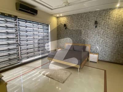 "1-Kanal Fully Furnished with Swimmg Pool Ultra-Modern Bungalow Built with Premium Materials 5 Elegant Bedrooms, Double Company Kitchens, and Green Serenity in DHA Phase 8 Block T by Emarat Real Estate & Developers"