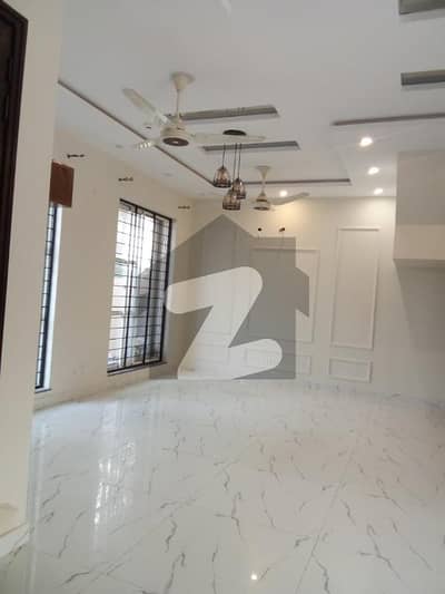 Gracefully Designed 7.5-Marla Home in DHA 9-Town A Block Premium Material Used, Grand Entrance, Neat Interiors, and Lush Green Lawn for Only 160K (Negotiable)!