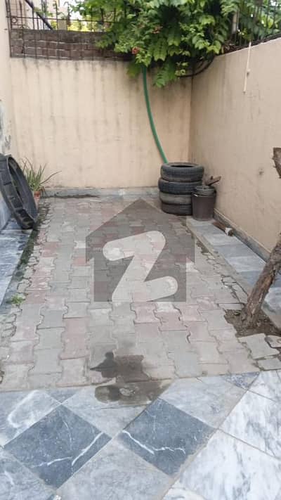 2 kanal double story house facing park on 80 feet rode available for sale in Model Town, Lahore.