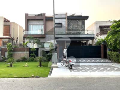 One Kanal Brand New Luxury Ultra-Modern Design Most Beautiful Fully Furnished Bungalow 15KV Solar Installed 2 Servant Quarter In Basement For Sale At Prime Location Of DHA Lahore Near To Park Masjid & Commercial Market.