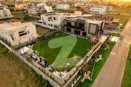 2 kanal brand new phase 5 1kanal lawn fully basment fully furnished top location for sale in DHA Lahore.