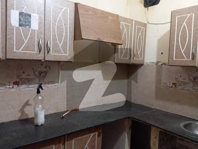 Ground floor portion in Block 14 with 2 rooms and 1 kitchen, prime location, no water issues or load shedding ideal for a small family.