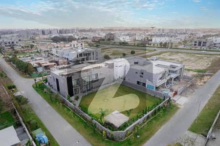 2 KANAL LUSH GREEN LAWN WITH 1 KANAL ULTRA MODERN MAZHAR DESIGN FULLY FURNISHED CORNER BUNGALOW WITH INDOOR SWIMMING POOL,HOME CENIMA AND 10 KVA SOLAR INSTALLED FOR SALE IN DHA PHASE 7 NEAR TO RAYA.