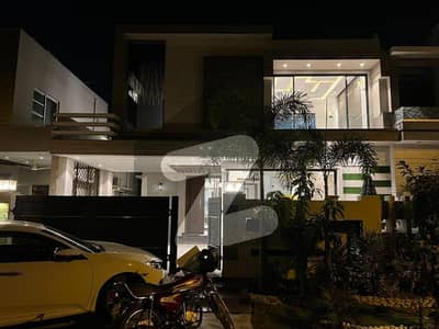 UTRA MODERN DESIGN 10 MARLA ELEGANT AND FULLY MAINTAINED SUPER HOT LOCATED BUNGALOW IS AVAILABLE IN THE BEST BLOCK OF DHA LAHORE. 12KVA SOLAR INSTALLED