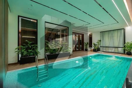 FACING PARK 23 MARLA TOP OF THE LINE ULTRA MODERN FULL BASEMENT FULLY FURNISHED BUNGALOW WITH DOUBLE HEIGHTED TV LOUNGE,INDOOR SWIMMING POOL,HOME CENIMA,LIFT AND ROOF TOP FOR SALE IN DHA PHASE 7 NEAR TO RAYA.