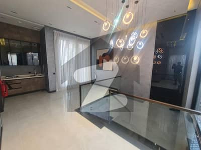DHA Phase 5 Sector D 10-Marla House for Sale Perfect Blend of Luxury & Functionality with Basement, Spacious Lounges, Multiple Kitchens, Terraces, and Patio